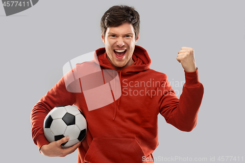 Image of happy man or football fan with soccer ball winning