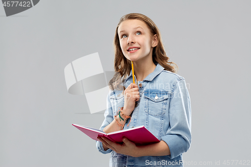 Image of teenage student girl with diary or notebook