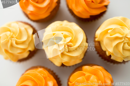 Image of cupcakes with frosting on white background