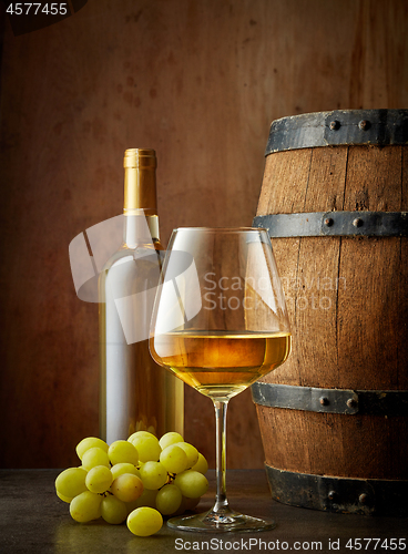 Image of glass and bottle of white wine