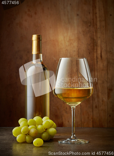 Image of glass and bottle of white wine