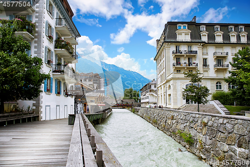 Image of Arve river, buildings of Chamonix and Mont Blanc Massif