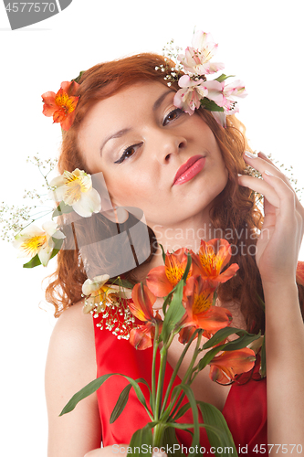 Image of Portrait of beautiful woman with spring flowers on white