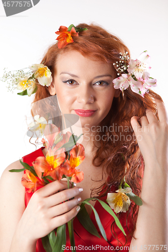 Image of Portrait of beautiful woman with spring flowers