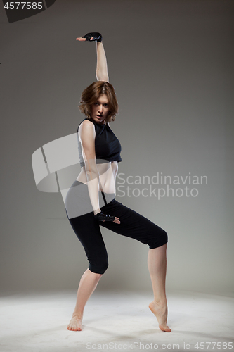 Image of attractive young woman dancing