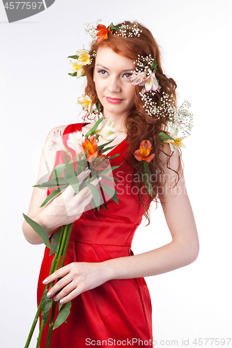 Image of Portrait of beautiful woman with spring flowers