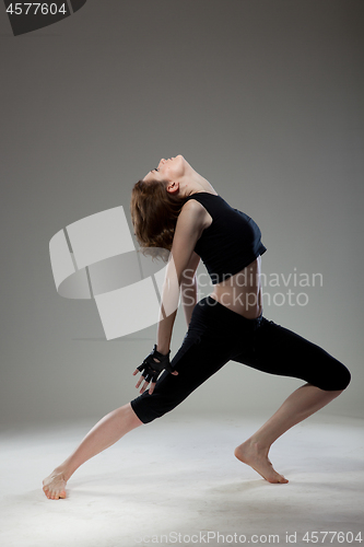 Image of attractive young woman dancing