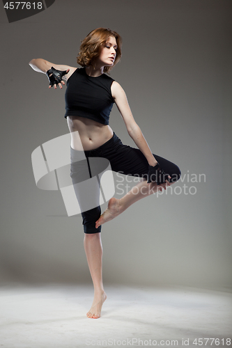 Image of attractive young woman dancing