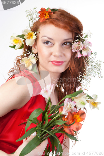 Image of Portrait of beautiful woman with spring flowers