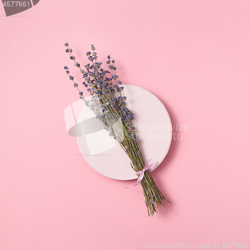 Image of Organic lavender branch on a ceramic plate.