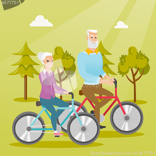 Image of Happy senior couple riding on bicycles in park.