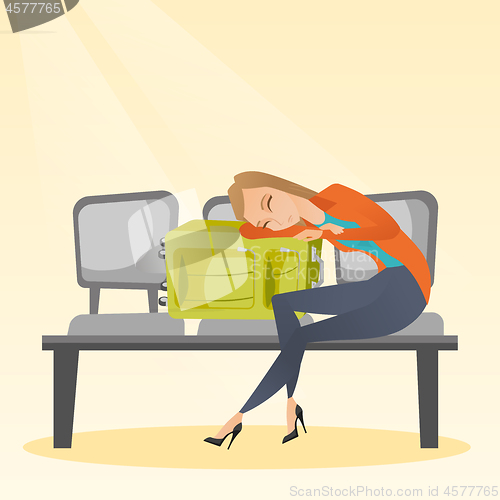 Image of Tired woman sleeping on suitcase at the airport.