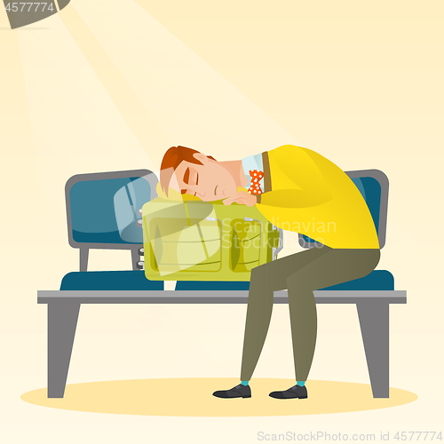 Image of Exhausted man sleeping on suitcase at the airport.