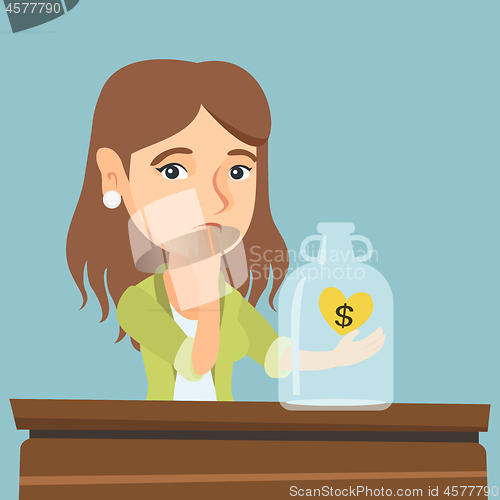 Image of Caucasian broke woman looking at empty money box.