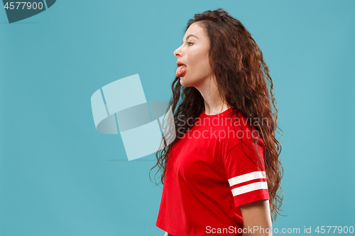 Image of Beautiful woman in stress isolated on blue