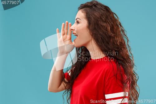 Image of Isolated on pink young casual woman shouting at studio