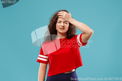 Image of Beautiful woman in stress isolated on blue