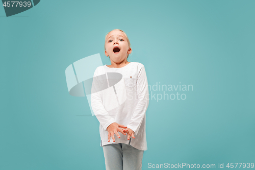 Image of Portrait of the scared girl on blue