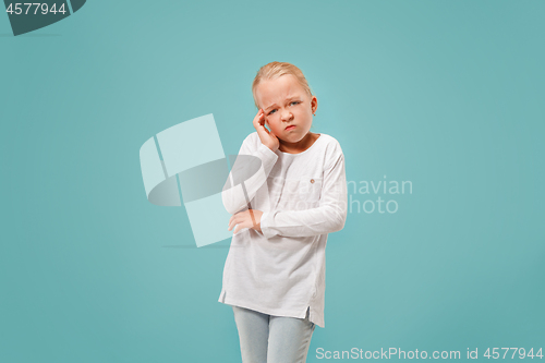 Image of Woman having headache. Isolated over blue background.