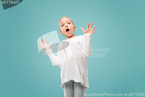 Image of Portrait of the scared girl on blue