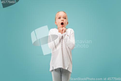 Image of Portrait of the scared girl on blue