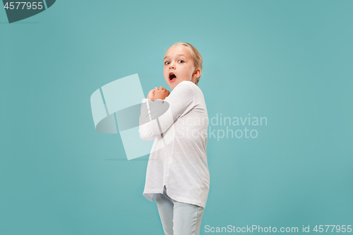 Image of Portrait of the scared girl on blue