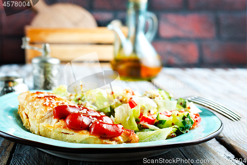 Image of fried chicken breast and salad