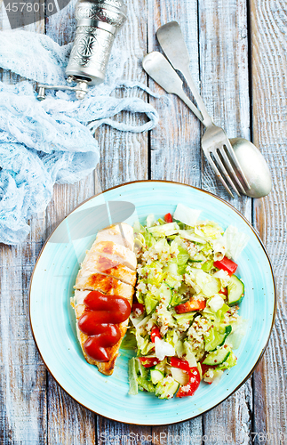 Image of fried chicken breast and salad