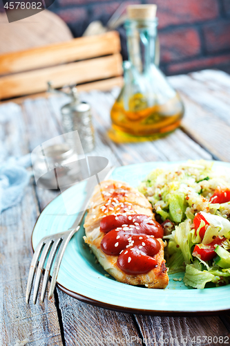 Image of fried chicken breast and salad