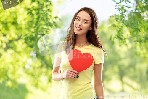 Image of smiling teenage girl with red heart