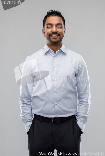 Image of indian businessman in shirt over grey background