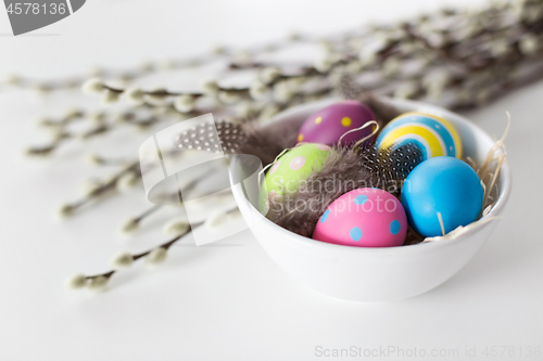 Image of colored easter eggs and pussy willow branches