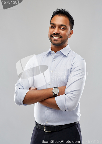 Image of happy indian businessman in shirt over grey