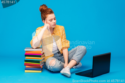 Image of sad red haired teenage student girl with laptop