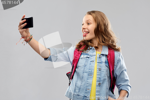 Image of teenage student girl taking selfie by smartphone