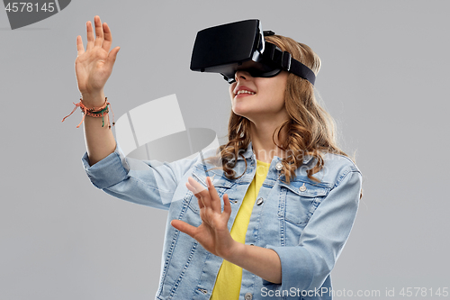 Image of teen girl in virtual reality headset or vr glasses