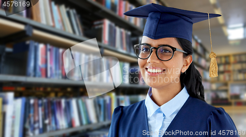 Image of happy female graduate student in mortarboard