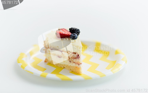 Image of piece of berry layer cake on disposable plate