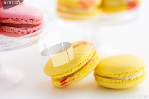 Image of close up of yellow and pink macarons