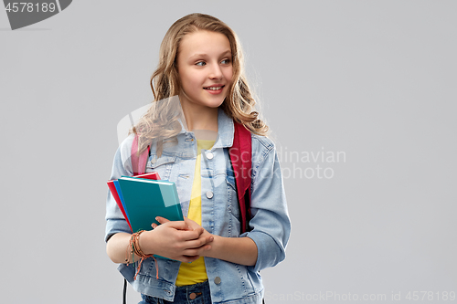 Image of happy smiling teenage student girl with school bag