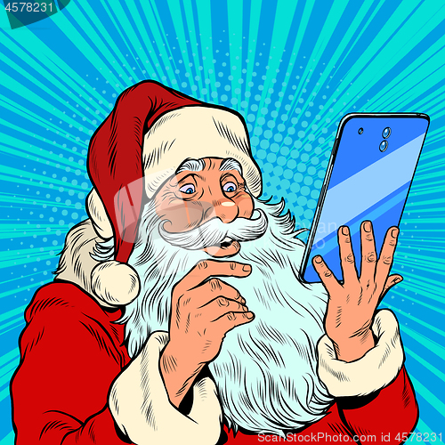 Image of Santa Claus and a big smartphone. Electronic Christmas sales and orders in online stores