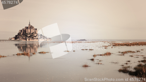 Image of Mont-Saint-Michel reflecting, sepia effect