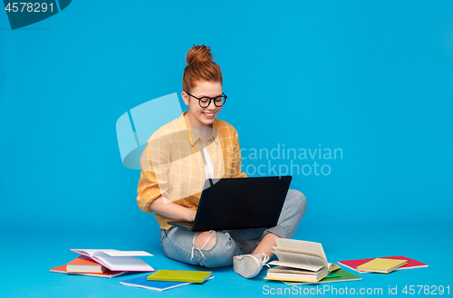 Image of red haired teenage student girl with laptop