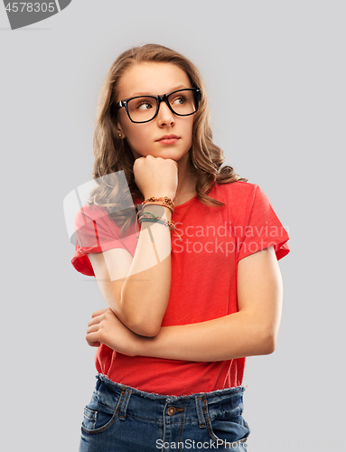 Image of student girl in glasses thinking