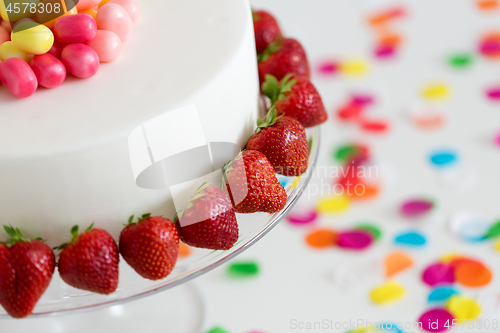 Image of close up of birthday cake with strawberries