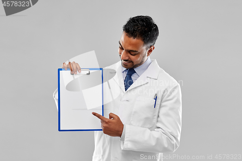 Image of doctor or scientist with white paper on clipboard