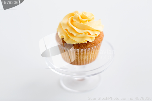 Image of cupcake with frosting on confectionery stand