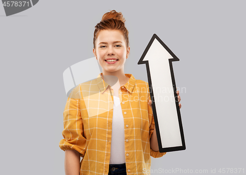 Image of red haired teenage girl with arrow showing up