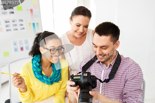 Image of photographers with camera at photo studio