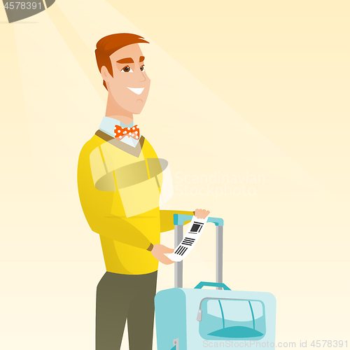 Image of Caucasian businessman showing luggage tag.